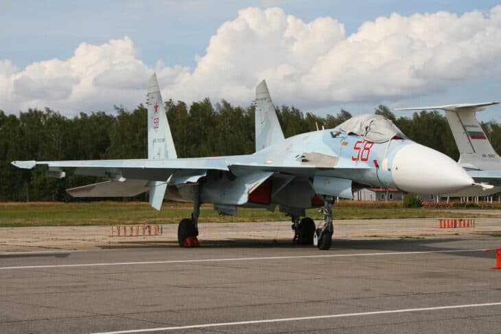Su-27SM3 Flanker 58 red on the apron under a cloudy sky