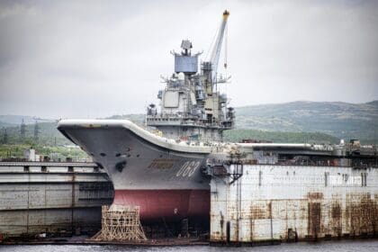 Admiral Kuznetsov aircraft carrier in a floating dry dock at Murmansk