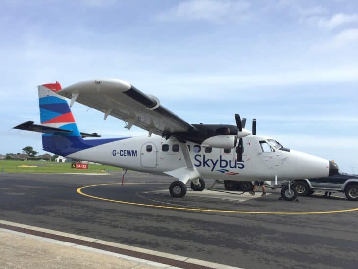 Skybus De Havilland Twin Otter parked on the apron at St Mary's Airport, Isles of Scilly
