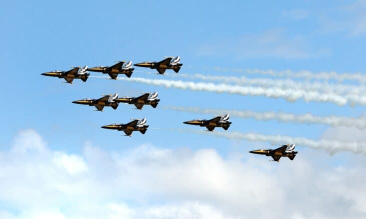 Republic of Korea Air Force Black Eagles T-50B aerobatic team flying in formation trailing smoke