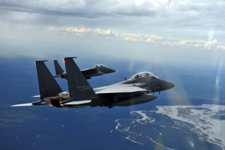 Republic of Korea Air Force F-15K Slam Eagle banking in flight with a second F-15K behind it