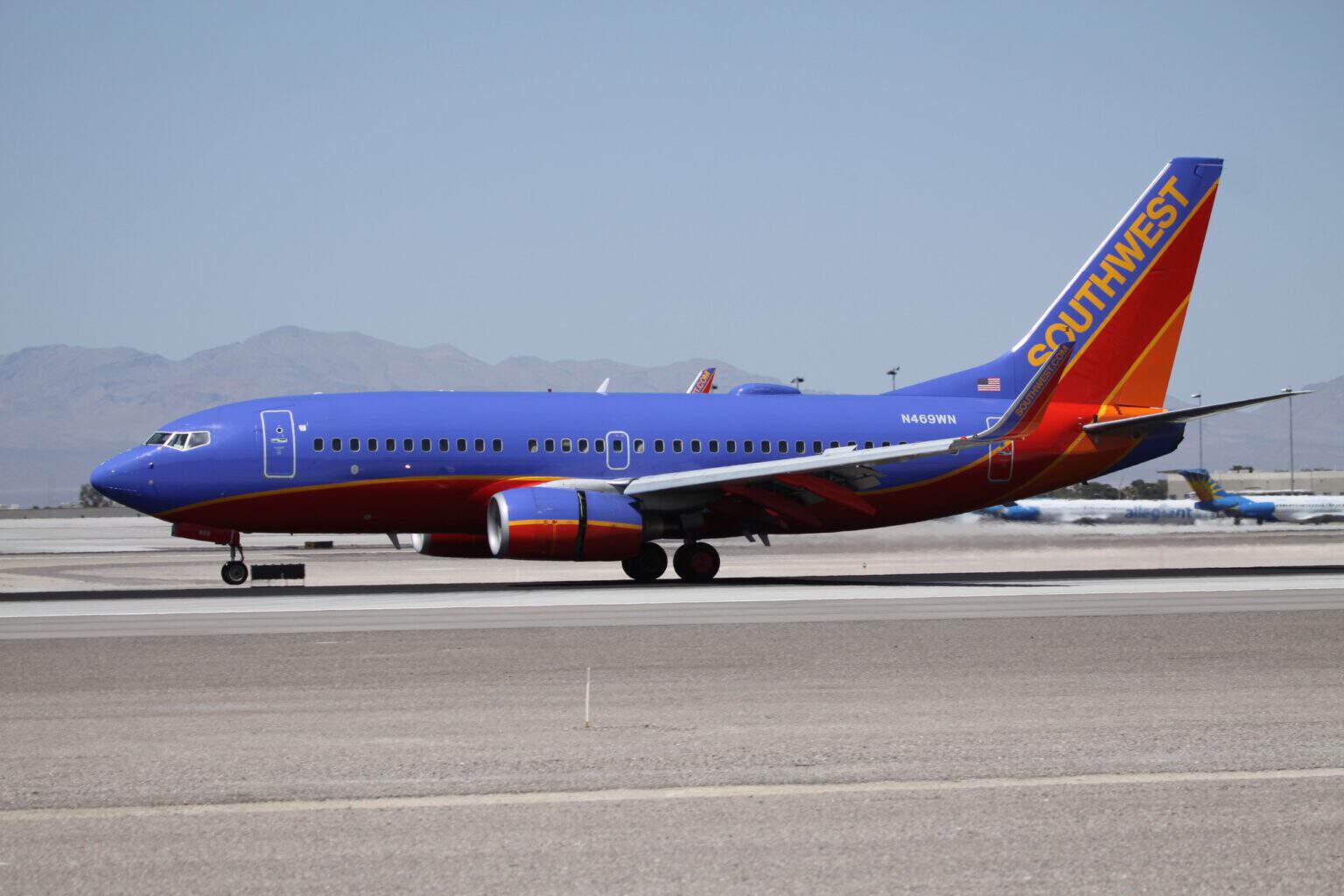 Southwest Airlines Boeing 737-700 N469WN on the ground at Las Vegas McCarran International Airport with desert mountains behind
