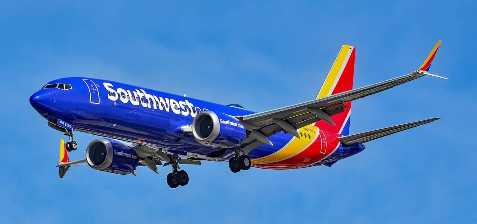 Southwest Airlines Boeing 737 MAX 8 in the current blue, red and yellow livery on approach with landing gear down