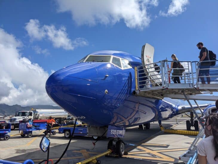 Passengers climbing air stairs to board a Southwest Airlines Boeing 737 at Honolulu