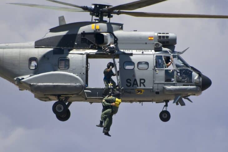 Spanish Air Force Super Puma SAR helicopter winching a rescuer