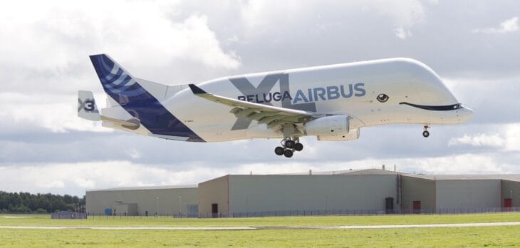 Airbus BelugaXL F-GXLI landing at Hawarden Airport with Airbus buildings behind