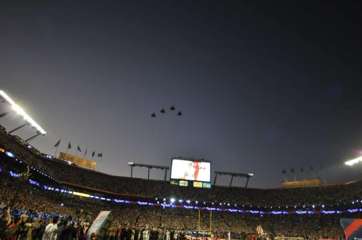 Air National Guard F-15C Eagles crossing Sun Life Stadium at dusk during the Super Bowl XLIV flyover