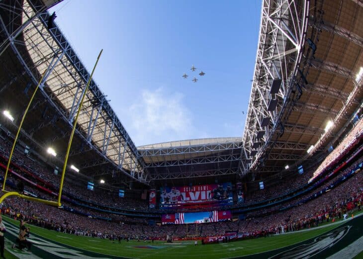 Navy all-woman formation flying over the open-roof State Farm Stadium during the Super Bowl LVII flyover