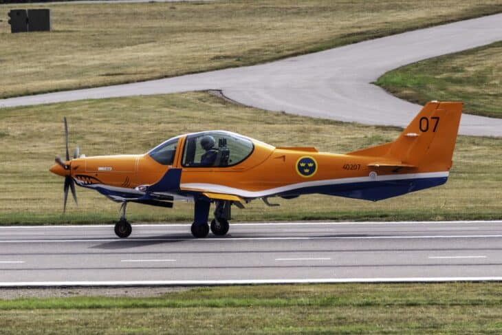 Orange Grob G 120TP trainer 40207, Swedish Air Force Sk 40, rolling along the runway