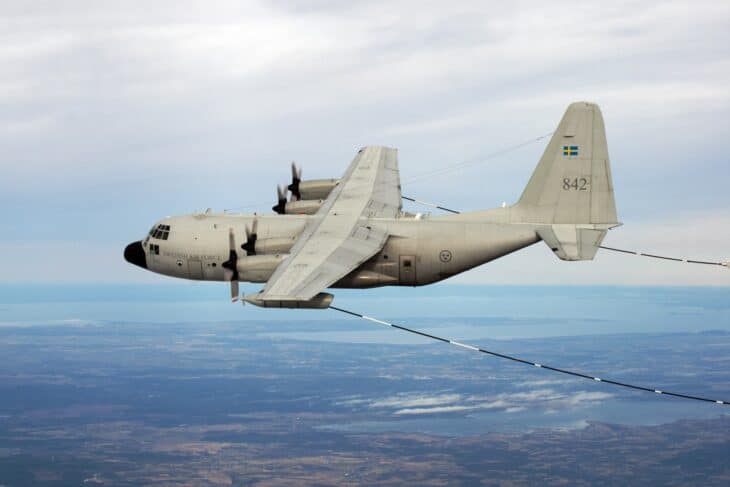 Swedish Air Force Tp 84 Hercules trailing a refuelling hose over cloud
