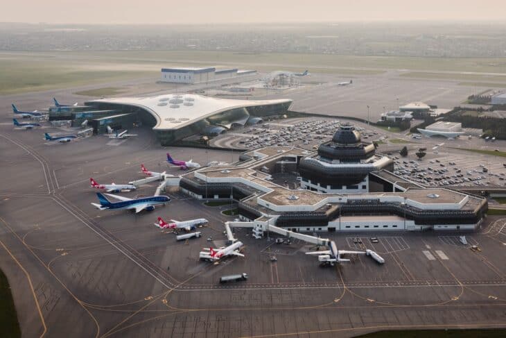 Aerial view of Heydar Aliyev International Airport in Baku with aircraft parked at the terminals
