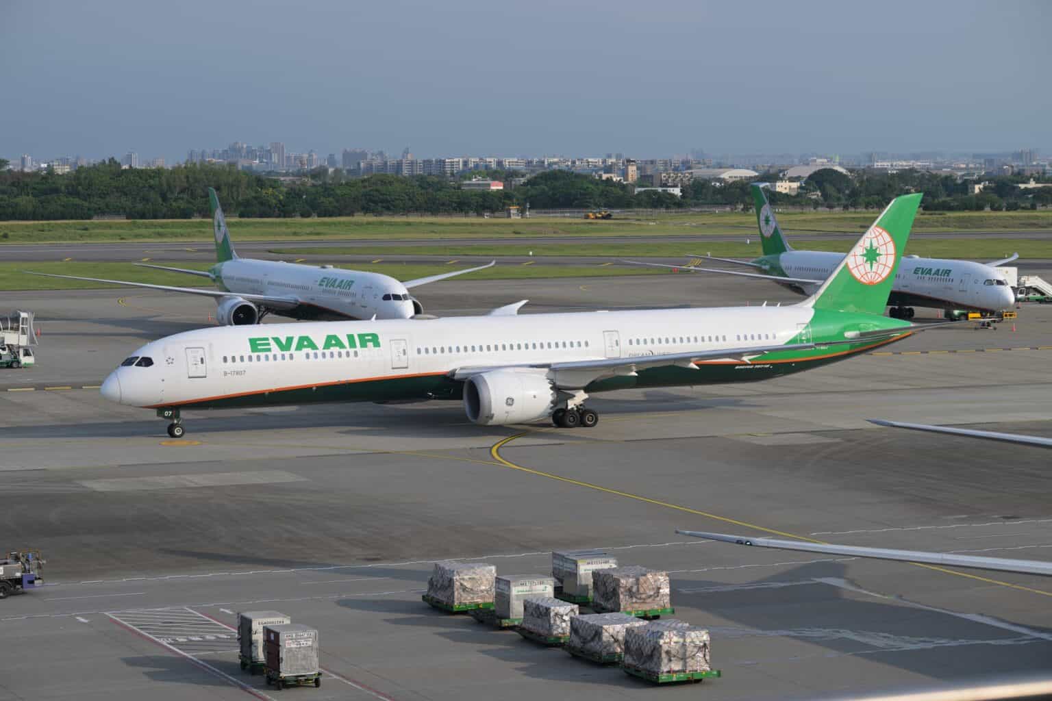 EVA Air Boeing 787-10 B-17807 taxiing past parked aircraft at Taoyuan airport