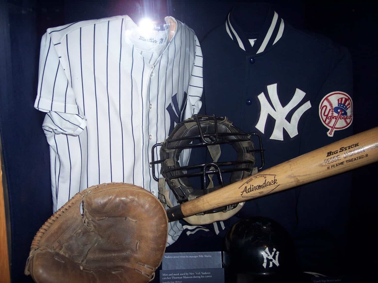 Thurman Munson's Yankees pinstripe jersey, catcher's mask, mitt and bat in a museum display
