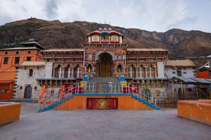 Badrinath Temple with its colourful facade below the Himalayan slopes