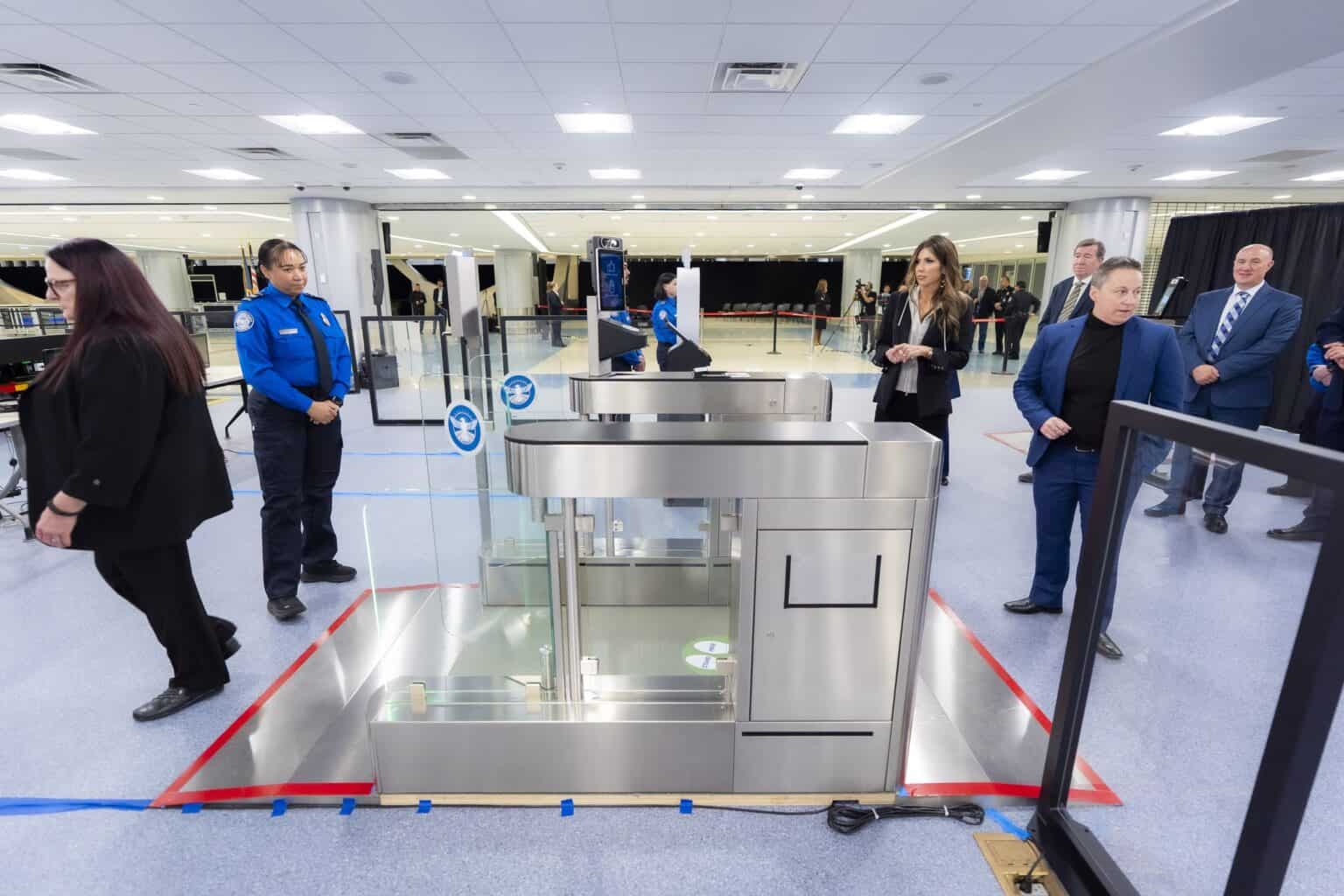 Officers and automated eGate screening units at a TSA checkpoint at Harry Reid International Airport in Las Vegas