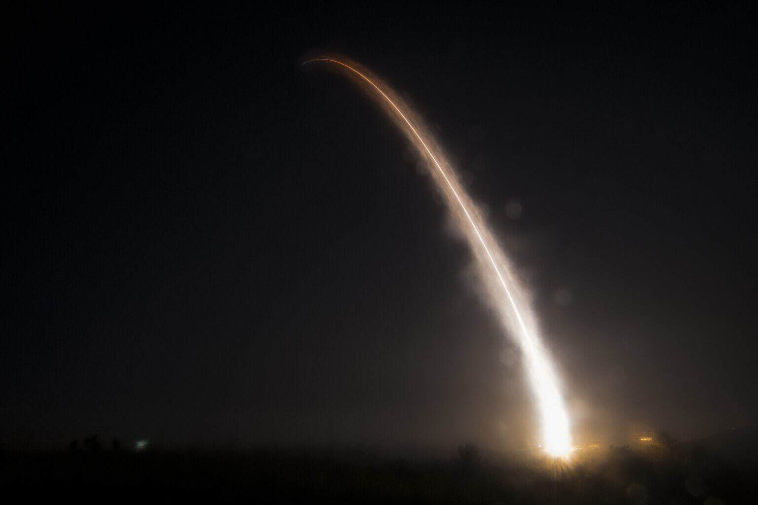 Minuteman III intercontinental ballistic missile arcing across the night sky after launch from Vandenberg