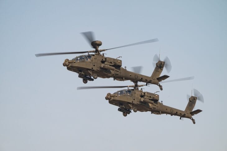 Two UAE Joint Aviation Command AH-64 Apache helicopters in flight