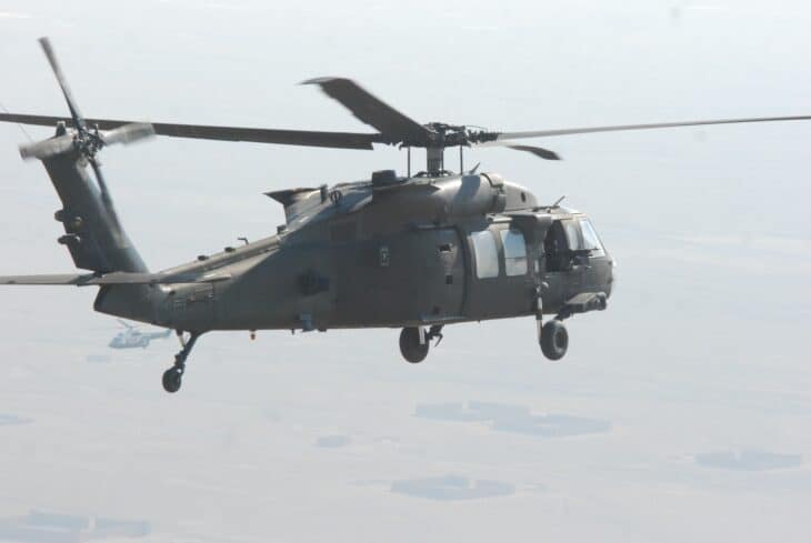 US Army UH-60M Black Hawk in flight over farmland