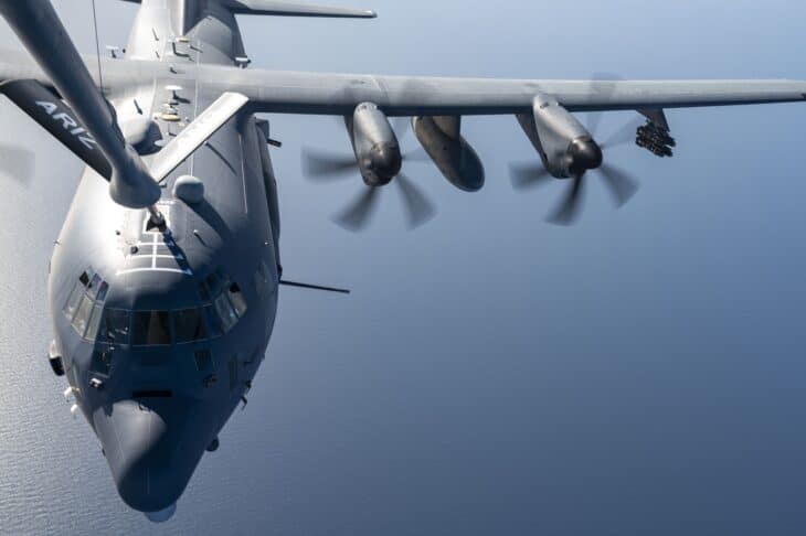US Air Force AC-130J Ghostrider gunship seen from a KC-135 tanker during aerial refueling over open water