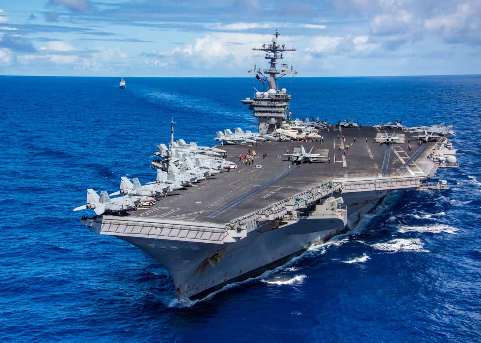 Aircraft carrier USS Carl Vinson (CVN-70) steaming across the western Pacific with aircraft parked on her flight deck