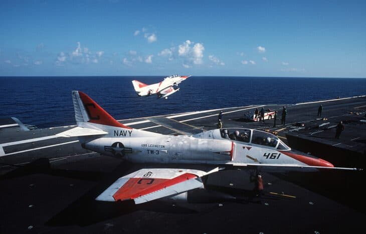 Two Douglas TA-4J Skyhawk trainers on the flight deck of USS Lexington (AVT-16)