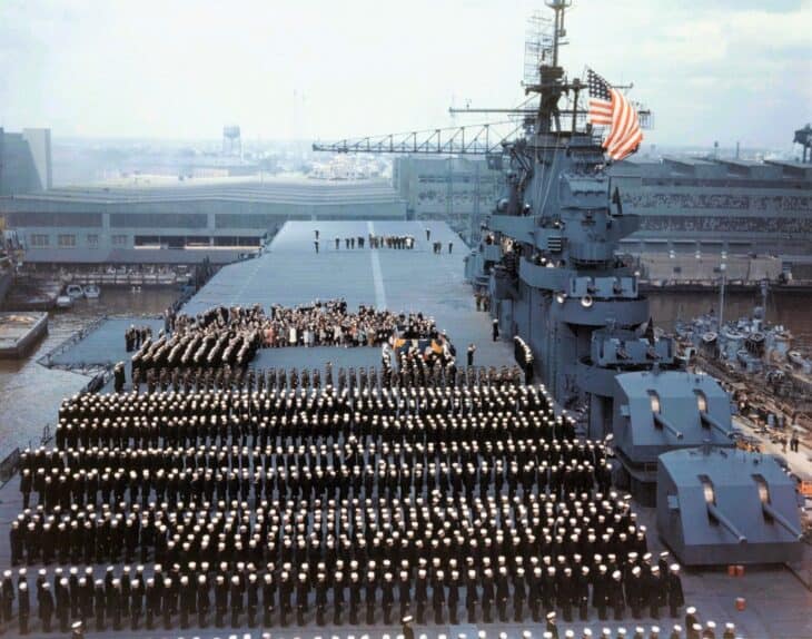 Crew in dress uniform lined up on the flight deck of USS Yorktown CV-10 at her commissioning on April 15, 1943