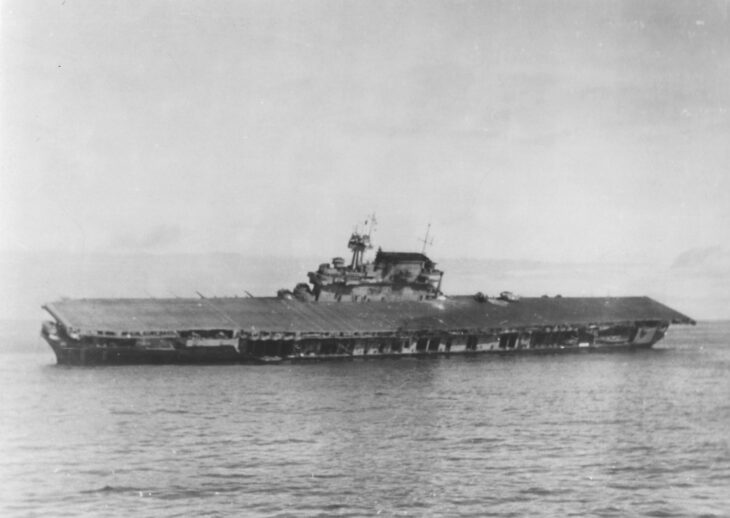 USS Yorktown CV-5 listing heavily to port and abandoned on June 4, 1942