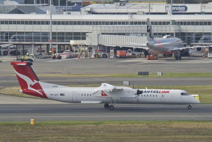 QantasLink Dash 8-400 taxiing past the terminal at Sydney Airport