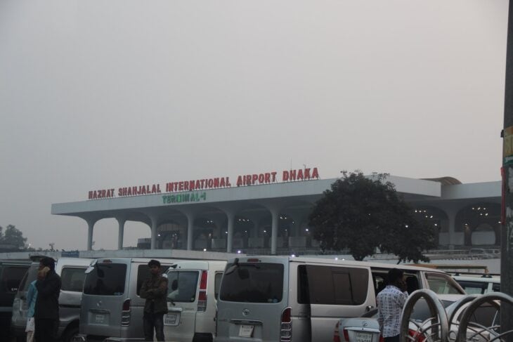 Terminal building of Hazrat Shahjalal International Airport in Dhaka with its name on the facade