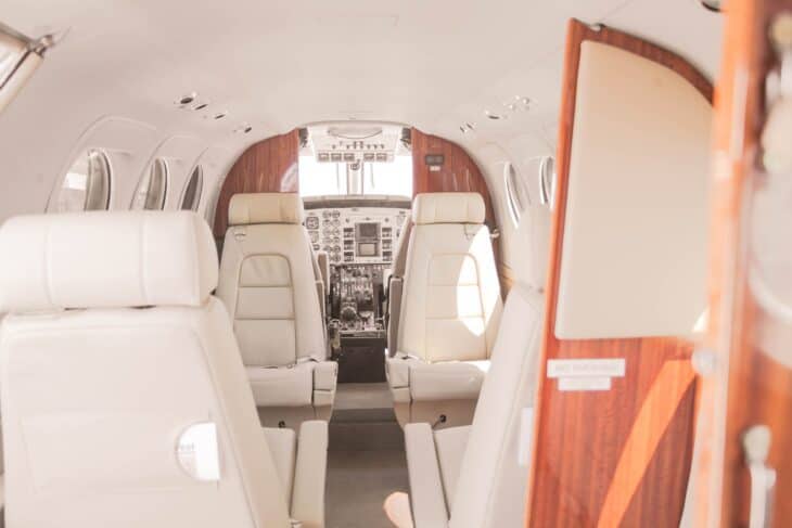 Cabin of a Beechcraft King Air seen from the rear with the entry door standing open