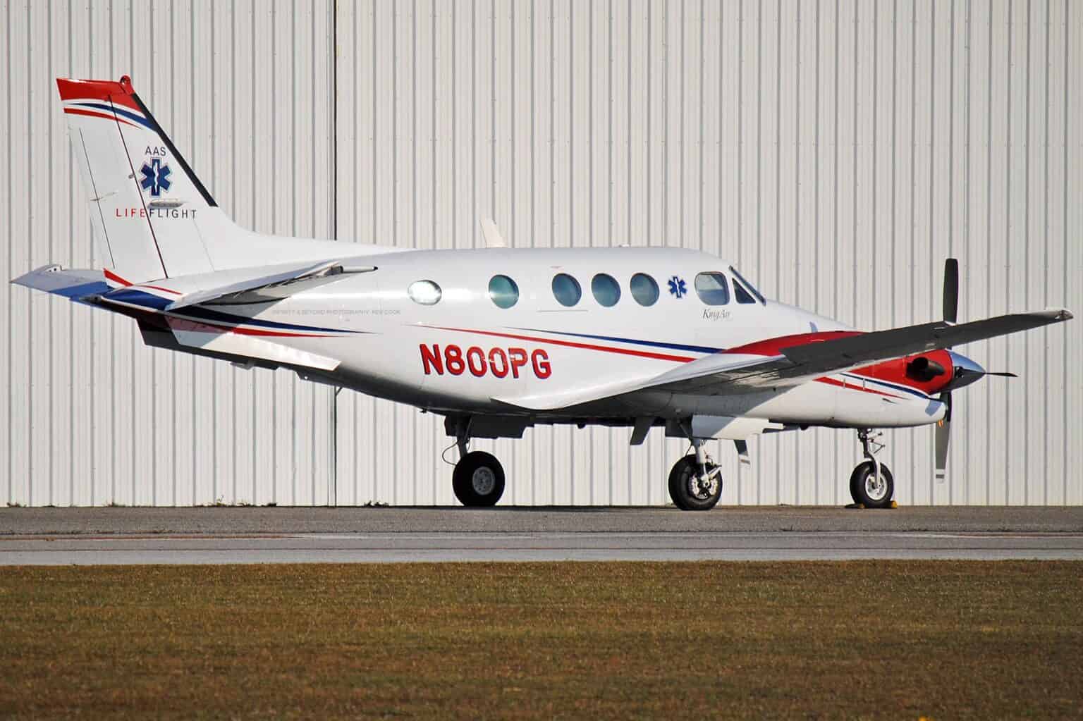 LifeFlight Beechcraft C90 King Air air ambulance N800PG parked outside a hangar