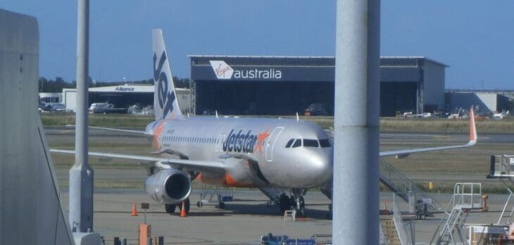 Jetstar Airbus A320 parked on the apron at Brisbane Airport