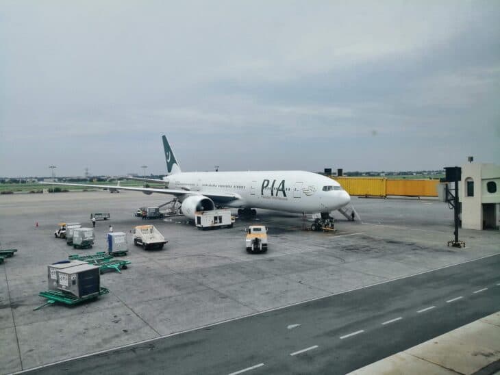 Pakistan International Airlines Boeing 777 parked on the apron at Lahore Allama Iqbal International Airport