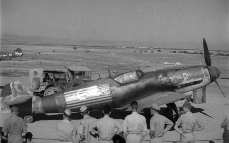 Constantin Cantacuzino's Messerschmitt Bf 109G on an Italian airfield with airmen standing around it