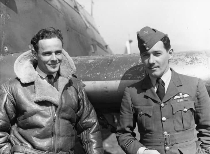 Squadron Leader Pat Pattle and another RAF pilot in flying gear in front of a fighter aircraft