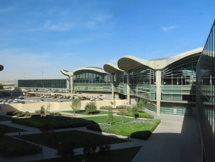 Curved concrete roof canopies and glass facade of the terminal at Queen Alia International Airport in Amman